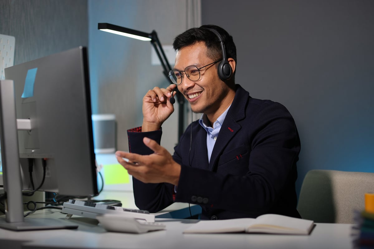 Call center operator working with a computer and headset